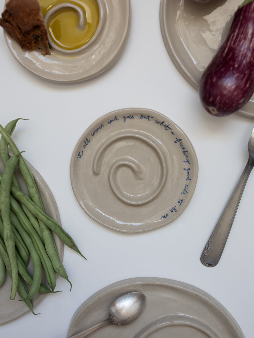 'IT ALL COMES AND GOES' Spiral Plate